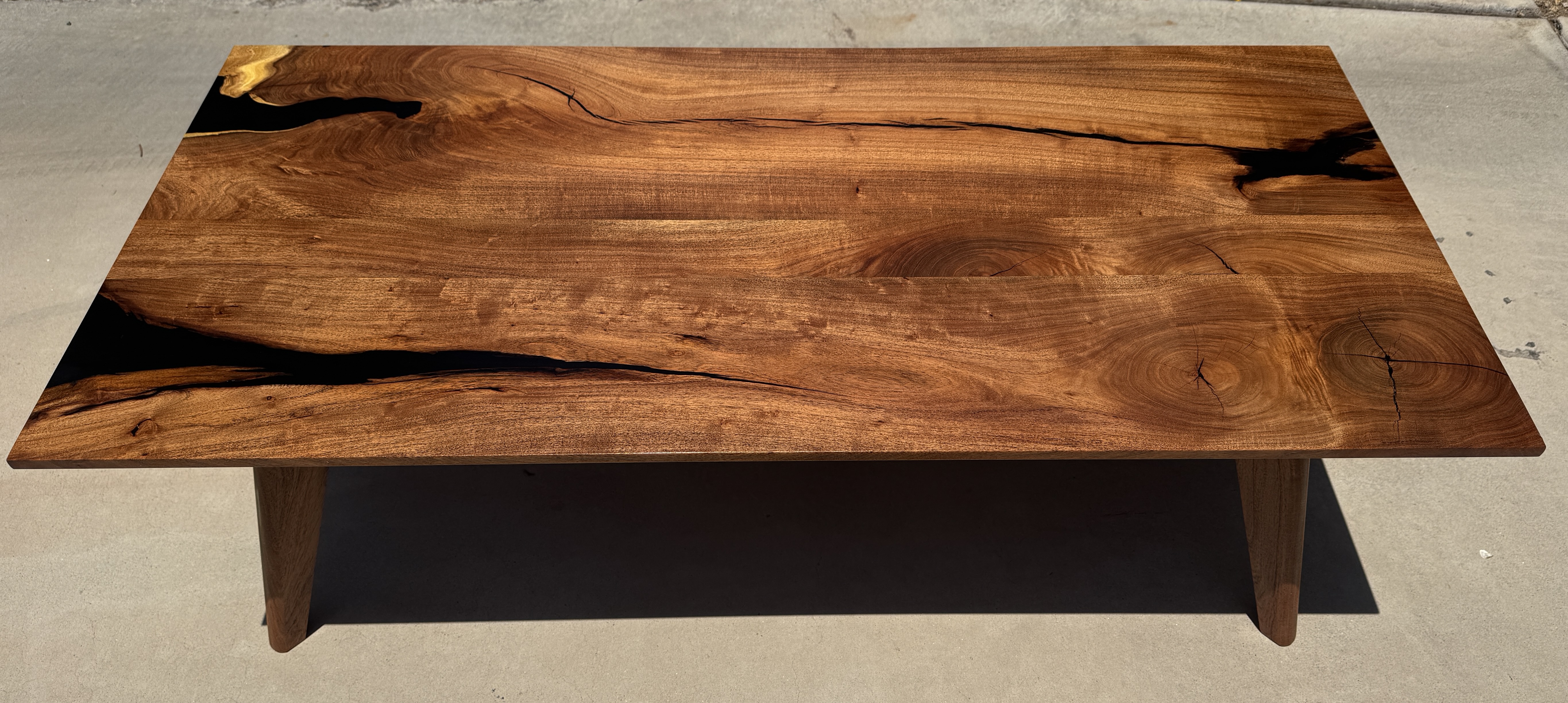 MCM Coffee table made from mesquite and utilizing Foureyes Furniture design